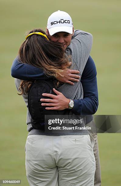 Martin Kaymer of Germany is congratulated on becoming world number one by coach Fanny Sunesson during the semifinal round of the Accenture Match Play...