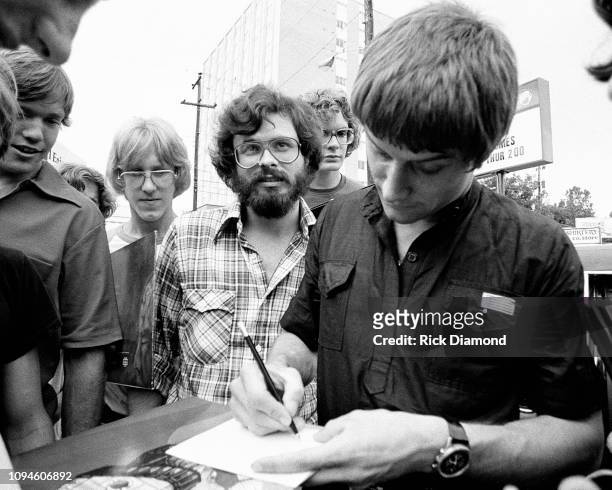 Atlantic Records Rob Senn and ELP's Carl Palmer of Emerson, Lake and Palmer at Peaches Records & Tapes in Atlanta Georgia June 23, 1977