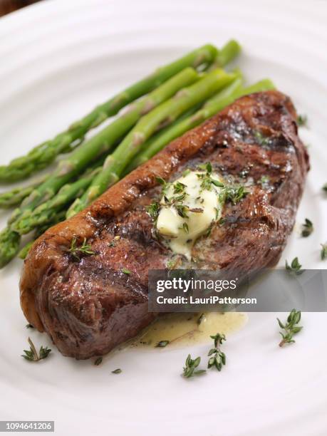 medium rare top sirloin steak with herb garlic butter - beef tenderloin stock pictures, royalty-free photos & images