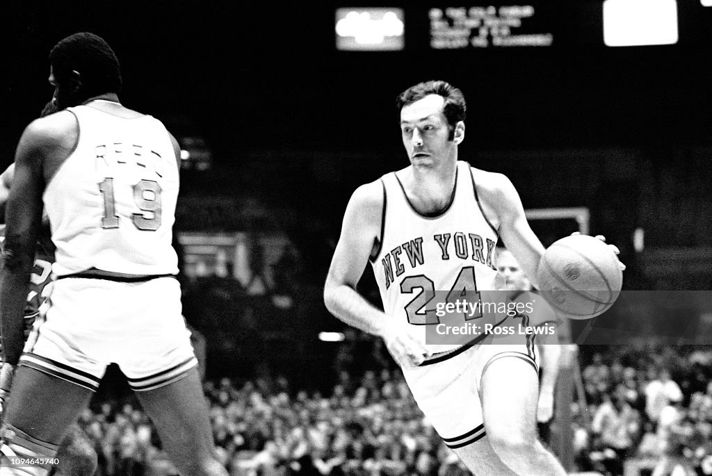 Bill Bradley, #24, Forward, of the New York Knicks, drives toward the basket as Willis Reed, Center, #19 sets a pick against the Buffalo Braves during an NBA basketball game in Madison Square Garden, New York, N.Y. , October 16, 1973.