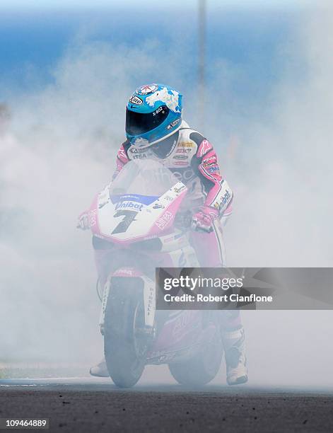 Carlos Checa of Spain riding the Althea Racing Ducati celebrates after winning race two of round one of the Superbike World Championship at Phillip...