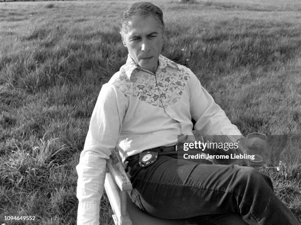 Portrait of American artist and filmmaker Alfred Leslie as he sits in a chair in a field outside his home in Amherst, Massachusetts, May 1976. He...