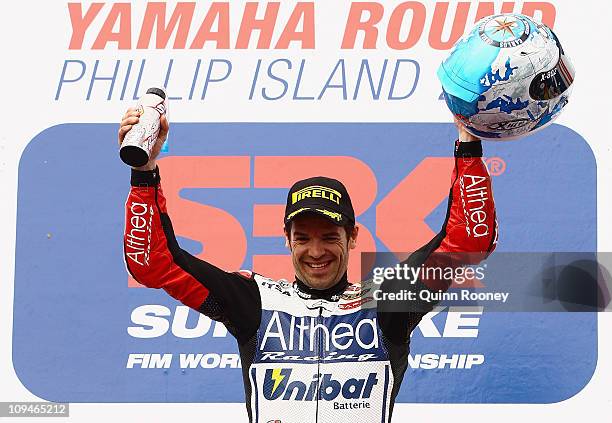 Carlos Checa of Spain and the Althea Racing Ducati team celebrates winning race two of round one of the Superbike World Championship at Phillip...