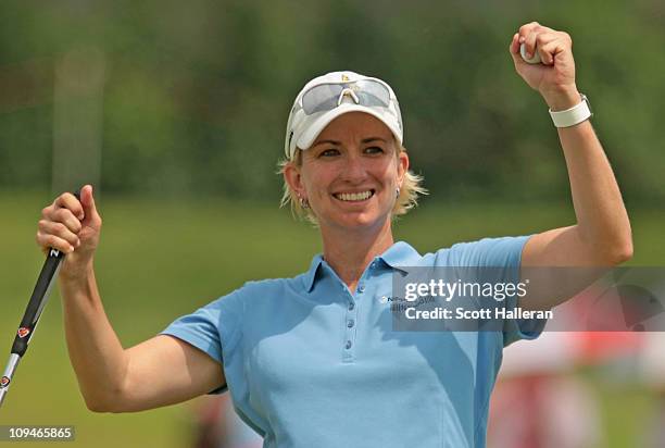 Karrie Webb of Australia celebrates her one-stroke victory at the HSBC Women's Champions 2011 at the Tanah Merah Country Club on February 27, 2011 in...