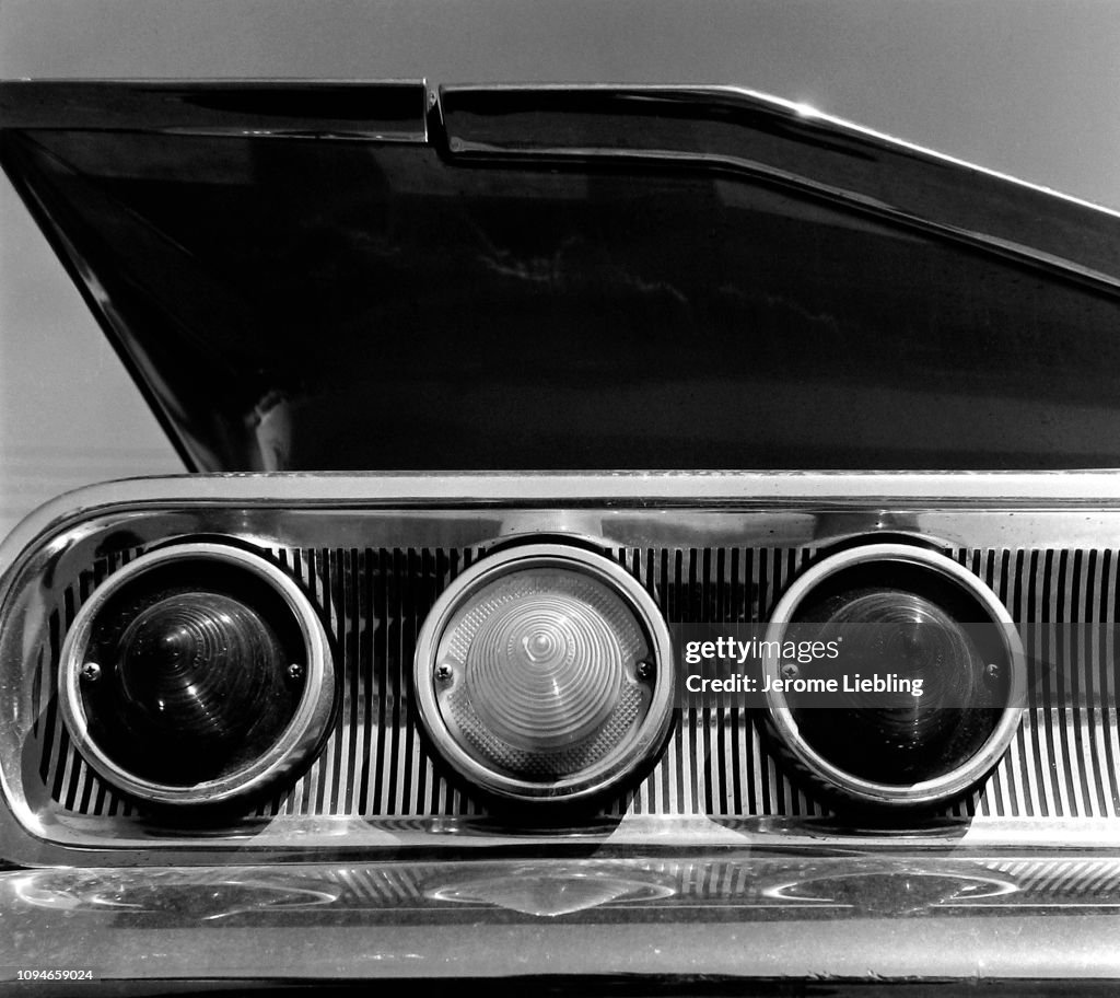 50s Car Rear Detail of three taillights and a tailfin on the rear of a 1950s... News ...