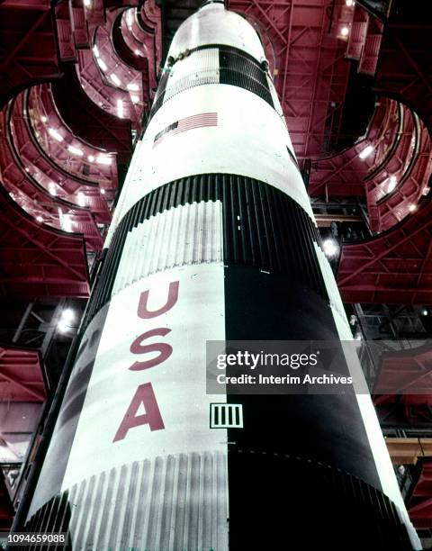 View looking up at work platforms surrounding a Saturn V 500F rocket in the Vehicle Assembly Building at the Kennedy Space Center, Florida, 1966.
