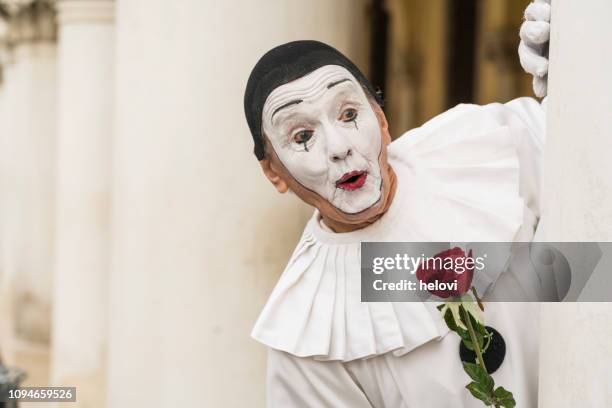 pierrot with red rose - venice - venice carnival stock pictures, royalty-free photos & images