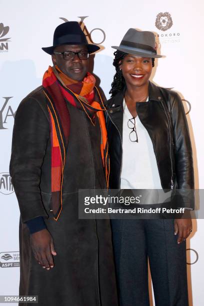 Football player Lilian Thuram and his companion journalist Kareen Guiock attend the "YAO" Paris Premiere at Le Grand Rex on January 15, 2019 in...
