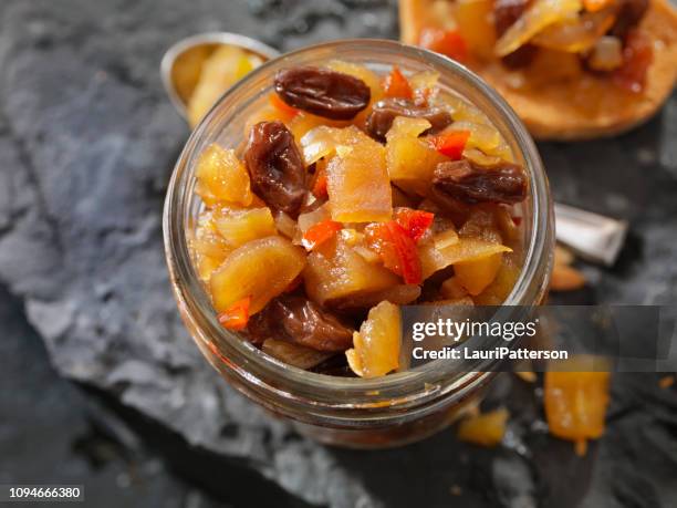 apple and ginger chutney with raisins - homemade apple sauce stock pictures, royalty-free photos & images