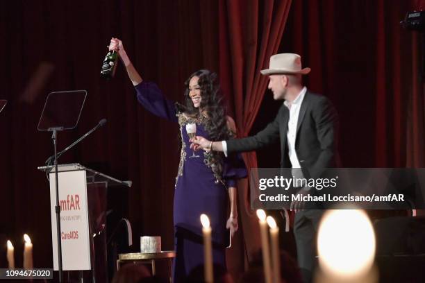 Winnie Harlow and Andrew Boose speak onstage during the amfAR New York Gala 2019 at Cipriani Wall Street on February 6, 2019 in New York City.