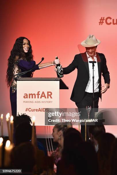 Winnie Harlow and Andrew Boose speak onstage during the amfAR New York Gala 2019 at Cipriani Wall Street on February 6, 2019 in New York City.