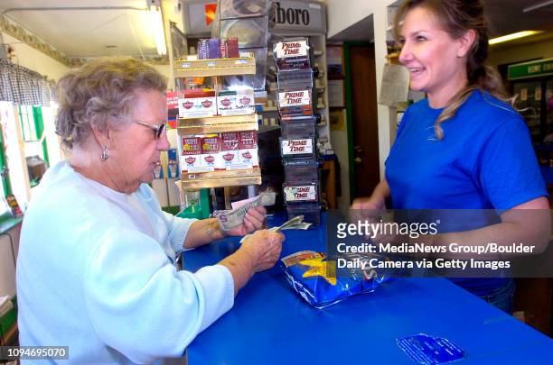 Louise Peterson, of Longmont, at left purchases a lottery ticket from Elaine Wents at the Country Corner Store on Monday September 28, 2009....