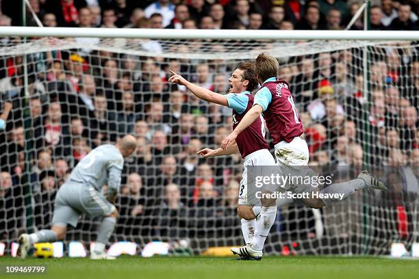 Scott Parker of West Ham celebrates with teammate Thomas Hitzlsperger as he scores the opening goal during the Barclays Premier League match between...