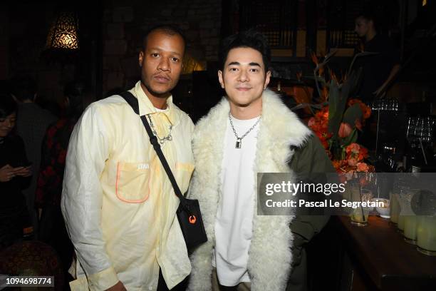 Heron Preston and a guest attend Heron Preston + UGG Paris Fashion Week Dinner At Le 404 Restaurant as part of Paris Fashion Week on January 15, 2019...