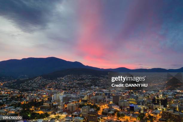 aerial view of hobart at dusk - hobart stockfoto's en -beelden