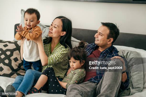 cosy family evening - family winter stock pictures, royalty-free photos & images