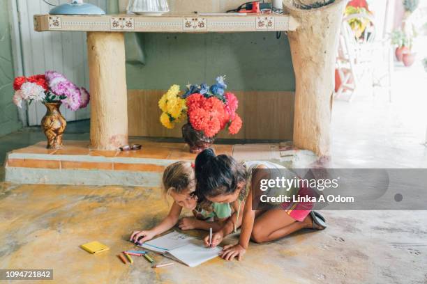 kids coloring in notepad on floor - kids crayon drawing stock pictures, royalty-free photos & images
