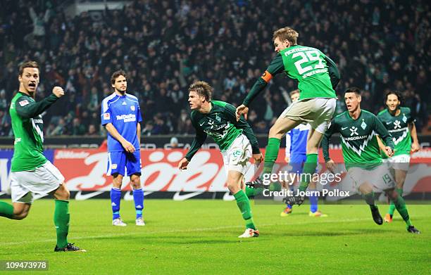 Sebastian Proedl of Bremen celebrates after scoring his team's second goal during the Bundesliga match between Werder Bremen and Bayer Leverkusen at...