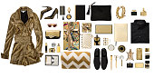 Luxury fashionable gold clothing and stationery items flat lay on white background