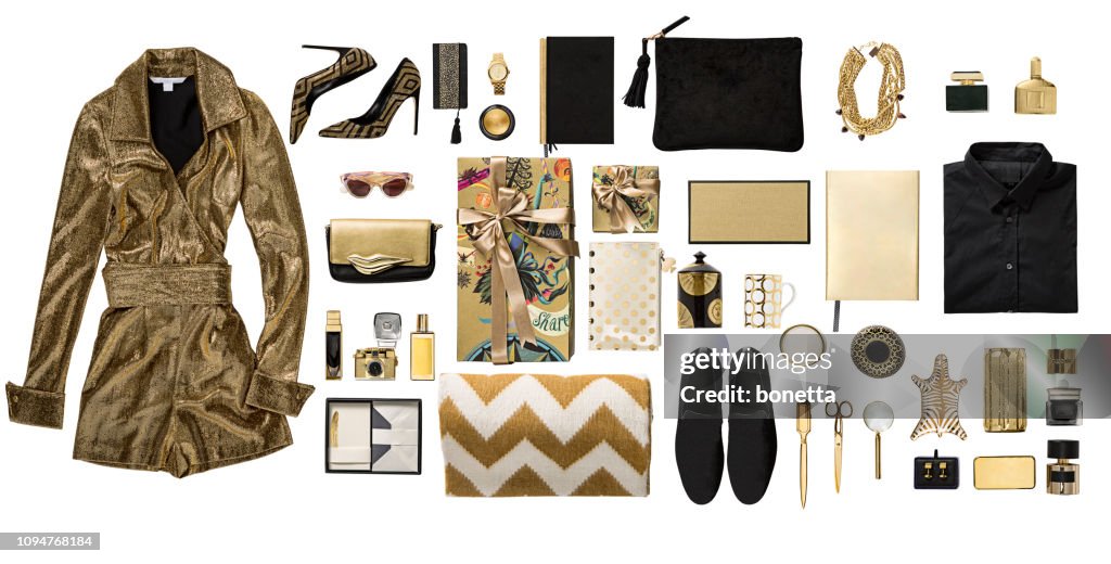 Luxury fashionable gold clothing and stationery items flat lay on white background