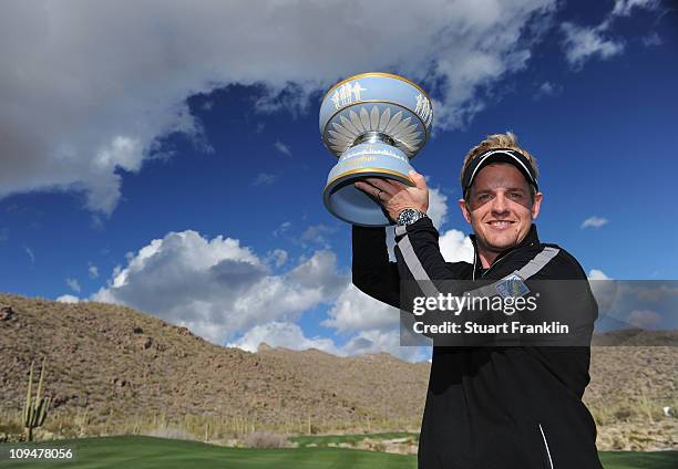 Luke Donald of England celebrates with The Walter Hagen Cup trophy after winning his match 3-up on the 16th hole during the final round of the...