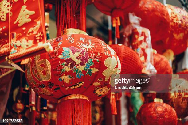 vibrant colours of lanterns, decorations and ornaments for chinese new year in celebration of luck, healthiness, happiness, reunion and prosperities - chinese new year stock pictures, royalty-free photos & images