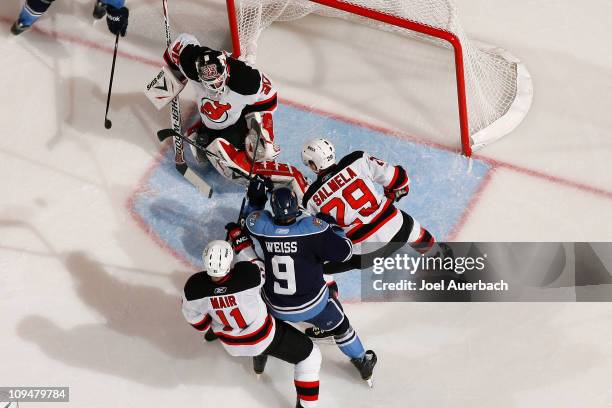 Goaltender Martin Brodeur of the New Jersey Devils stops a shot by Stephen Weiss of the Florida Panthers on February 27, 2011 at the BankAtlantic...