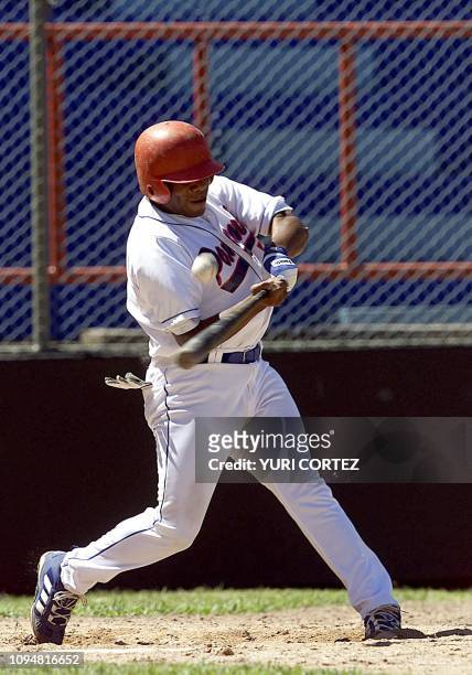 Panamanean Hipólito Ortíz takes a strike, 24 November 2002, during a game against El Salvadro, during the XIX Central American and Caribbean Games...