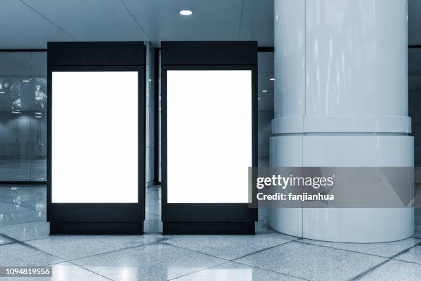 two blank billboards in lobby - billboard night stock pictures, royalty-free photos & images