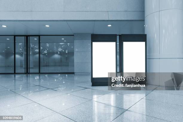 two blank billboards in lobby - evening news 2017 stock pictures, royalty-free photos & images