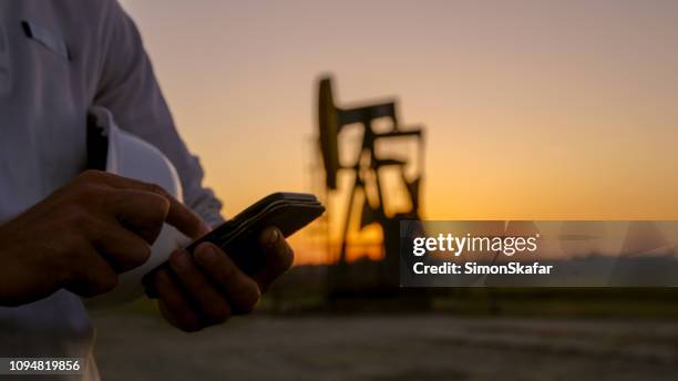 close up of smart phone - oil field stock pictures, royalty-free photos & images