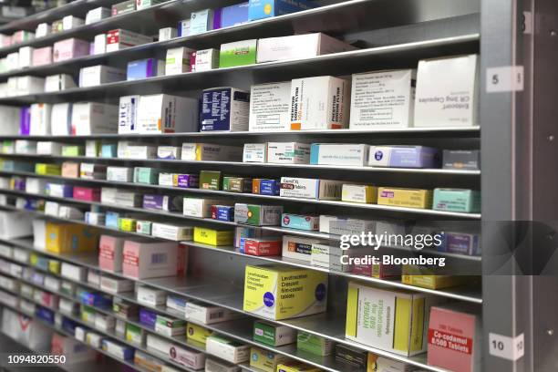 Packets of prescription medications sit on the shelves of the storage cabinet inside the robotic vending machine, built by Germany's Gollmann...