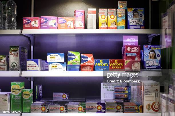 Packets of Paracetamol, Panadol, Hedex, Calpol, and Nurofen, sit alongside other over-the-counter medications on the shelves inside Hodgson Pharmacy...