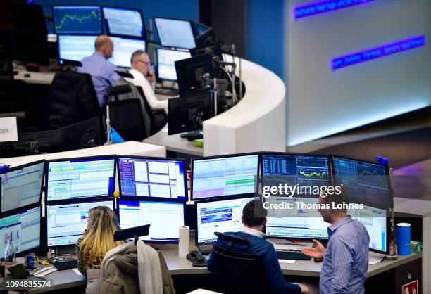 Traders work at the Frankfurt Stock Exchange the day after a large majority of MPs in the British House of Commons rejected British Prime Minister...