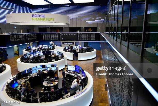 Traders work at the Frankfurt Stock Exchange the day after a large majority of MPs in the British House of Commons rejected British Prime Minister...