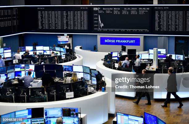 Traders work at the Frankfurt Stock Exchange the day after a large majority of MPs in the British House of Commons rejected British Prime Minister...