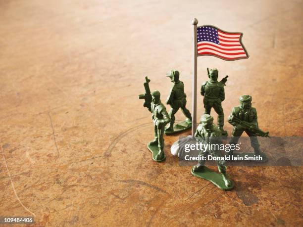 defending the flag - toy soldier stock pictures, royalty-free photos & images