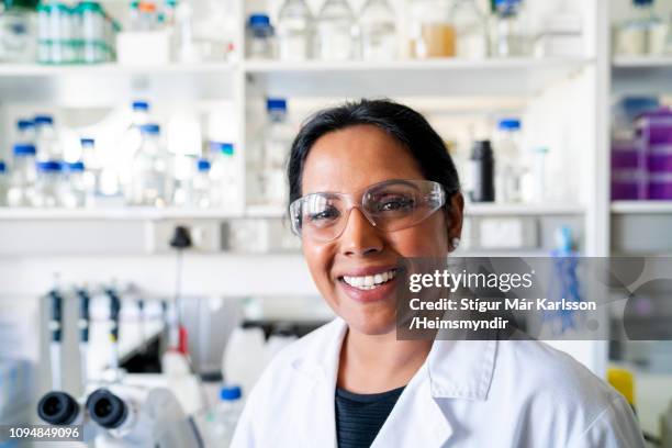 portrait of smiling mature researcher in lab - eye protection stock pictures, royalty-free photos & images