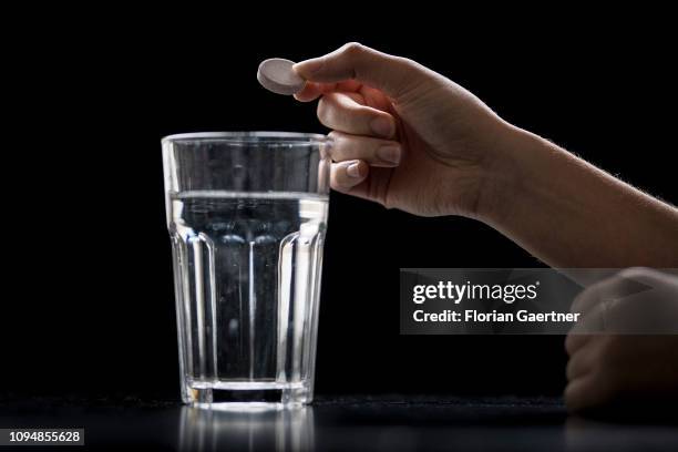 In this photo illustration a female person puts an effervescent tablet of iron into a glas of water on February 05, 2019 in Berlin, Germany.