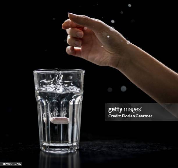 In this photo illustration a female person puts an effervescent tablet of iron into a glas of water on February 05, 2019 in Berlin, Germany.