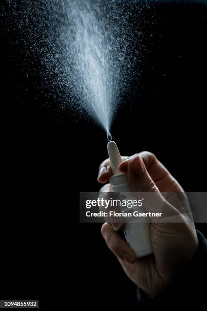 In this photo illustration a female person spray nasal spray on February 05, 2019 in Berlin, Germany.