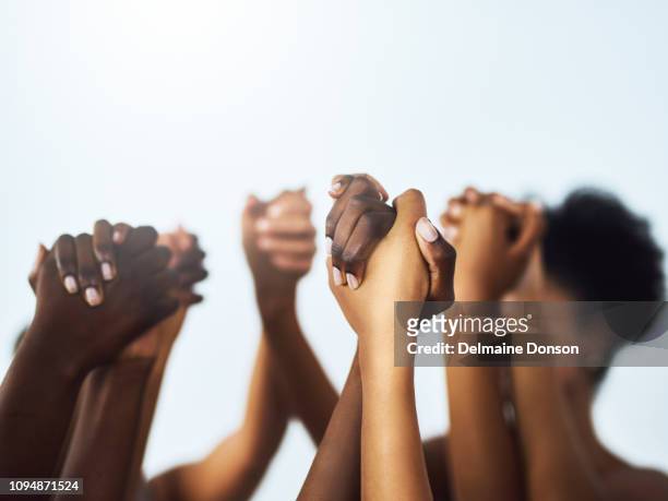 we should lift each other up as women - group of people holding hands stock pictures, royalty-free photos & images