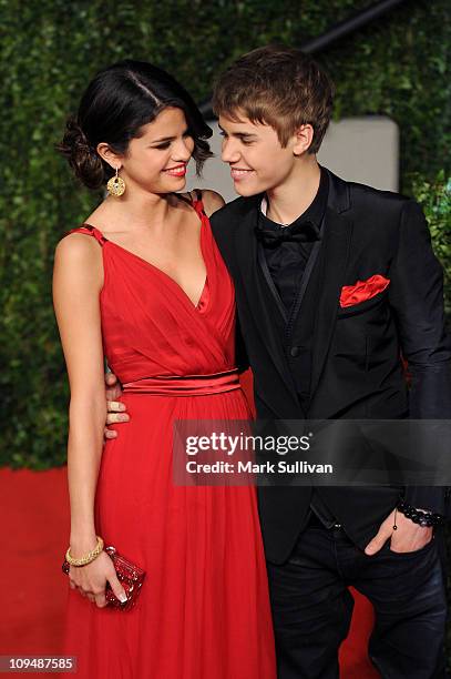 Singer-actress Selena Gomez and singer Justin Bieber arrive at the Vanity Fair Oscar party hosted by Graydon Carter held at Sunset Tower on February...