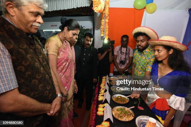 Vice-Chancellor Nitin Karmalkar and winner of the Miss World 1999 pageant, Yukta Mookhey, visit food stall of Mauritius students during International...