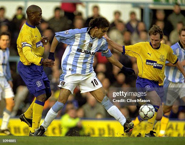 Moustapha Hadji of Coventry City breaks through a challenge from Kevin Campbell and Scott Gemmill of Everton during the FA Carling Premiership league...