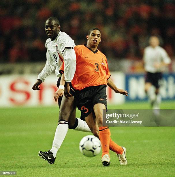 Michael Ricketts of England tussles with Michael Reiziger of Holland during the International Friendly match played at the Amsterdam ArenA, in...