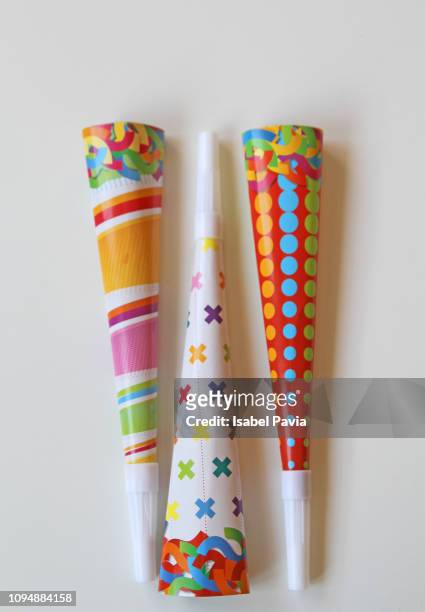 party blowers on white background - roltong stockfoto's en -beelden