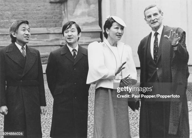 Crown Prince Akihito of Japan pictured on left with Princess Michiko and their son, Prince Naruhito as they are given a tour of Merton College,...