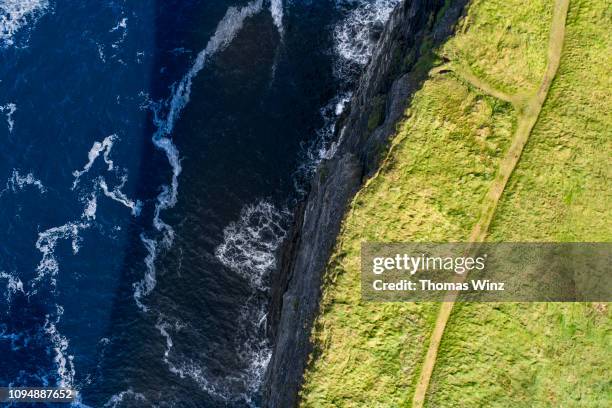 irish coastline aerial view waves and cliff - clare stock pictures, royalty-free photos & images