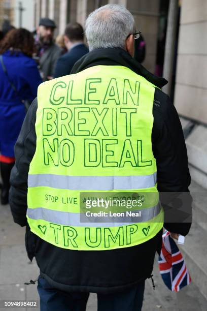 Pro-Brexit demonstrator looks on after a group of Labour MPs held a photocall in a bid to push Labour Party leader Jeremy Corbyn to fight for a...